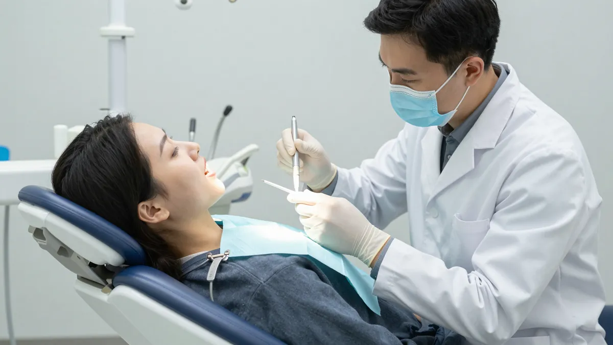 Dental patient reclined in the supine position with dentist at 12 o'clock