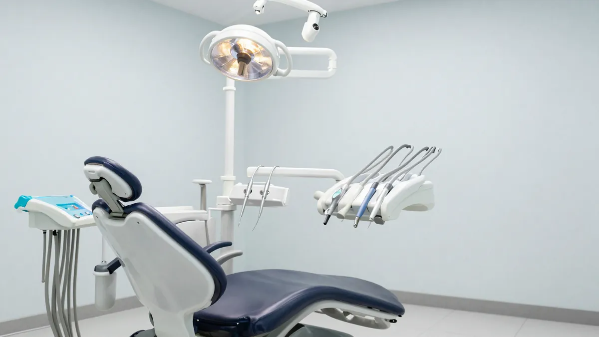 Complete dental chair unit showing delivery system, light and assistant arm