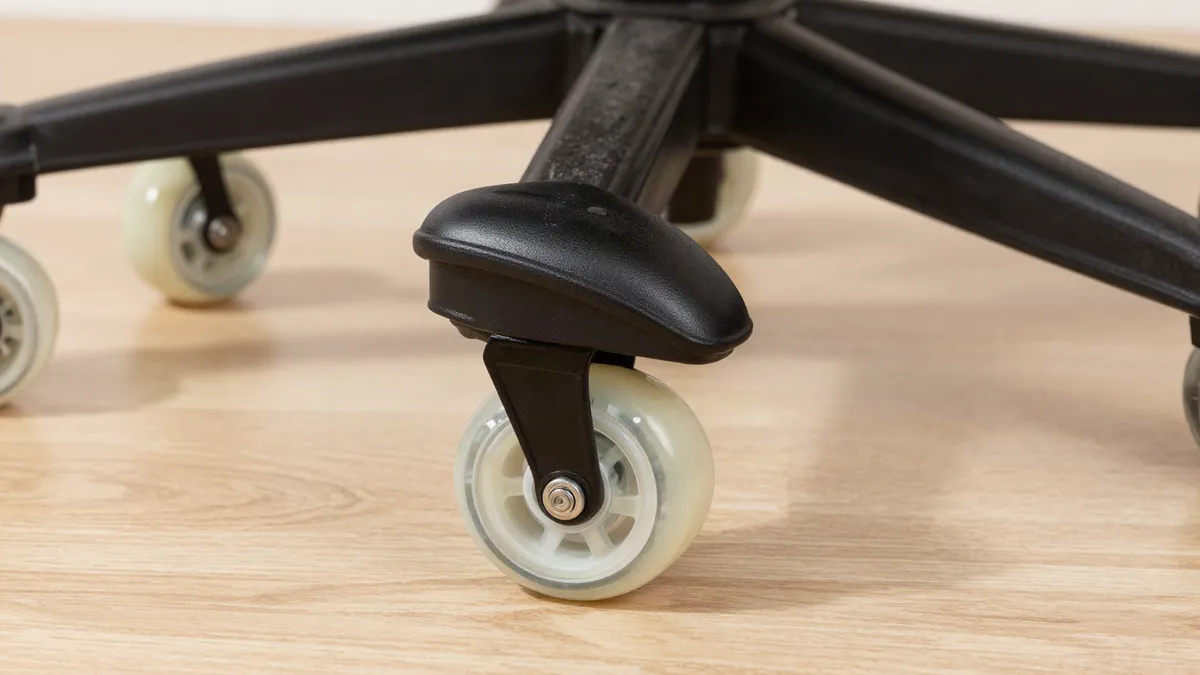 Clear rollerblade-style caster wheels on an office chair base on a hardwood floor